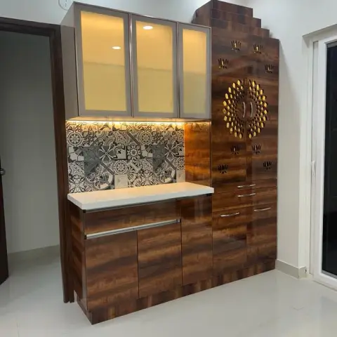 Walnut-laminate crockery unit with aluminium-framed frosted glass wall cabinets over a black-and-white patterned dado and white counter