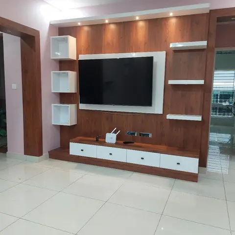 Walnut laminate TV feature wall with white cube display shelves and a floating console, against a lilac-painted living room wall.