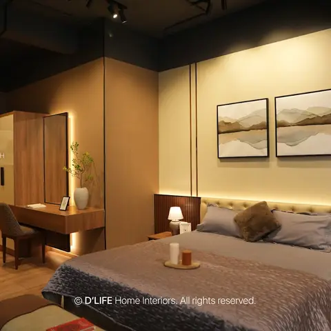 Warm-toned bedroom with a tufted headboard nook, dual framed landscape art, and a wall-mounted dresser with mirror beside a walk-in wardrobe.