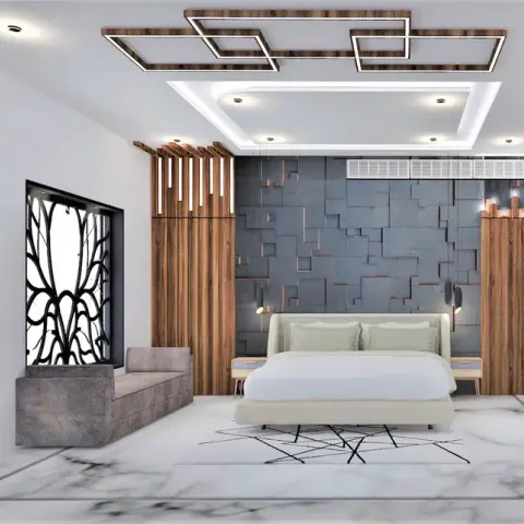 Wide bedroom with a grey 3D stone-block headboard wall lit through copper reveals, walnut fluted returns either side