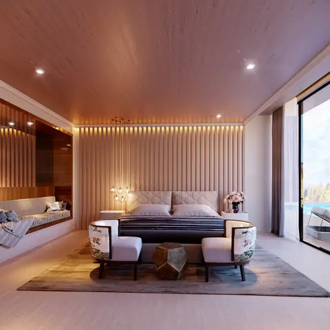 Wood-panelled bedroom with a centered bed flanked by two floral-print barrel chairs and a hanging cluster pendant